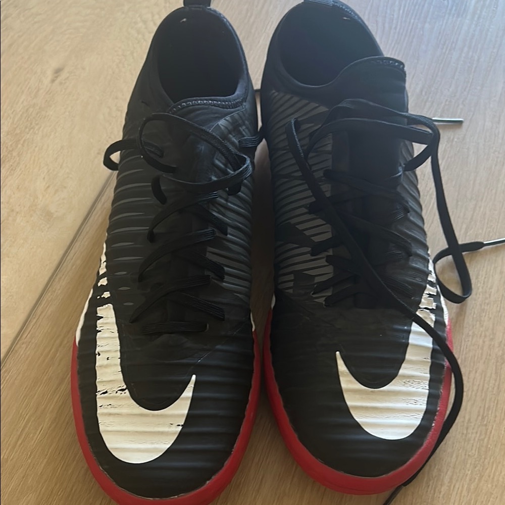 Nike Black Athletic Shoes with Red Sole and Swoosh
